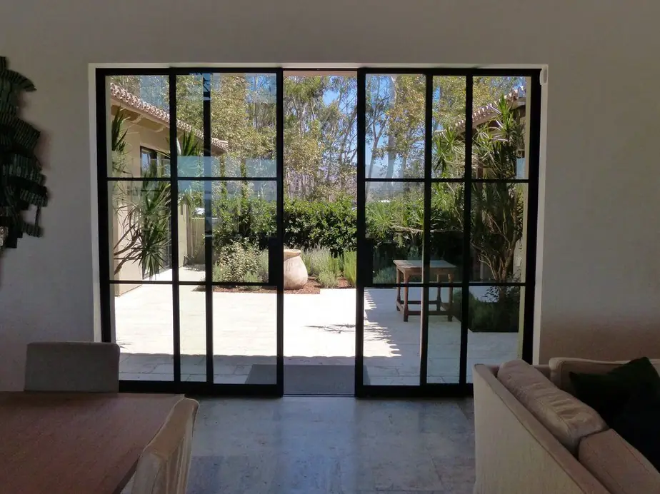Black steel-framed doors and windows installed in a Southern California home