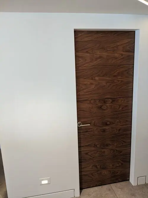 A modern flush walnut interior door, a real Builder's Window Supply install